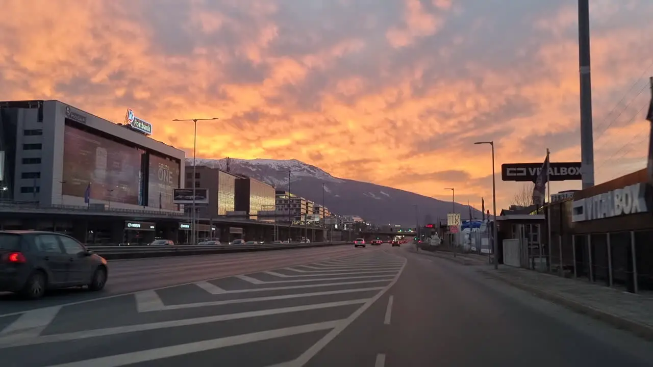 Driving on the Sofia south ring road and Cherni Vrah the summit of Vitosha Mountain at sunset