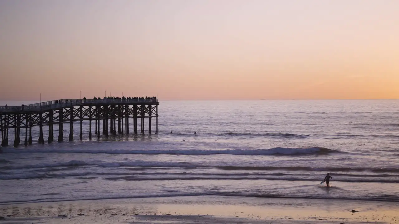 Pacific Beach California Sunset with Waves Crashing on Beach right side of pier blue hour