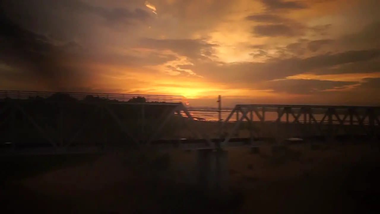 View from outside the windows of an express train evening with colorful sky