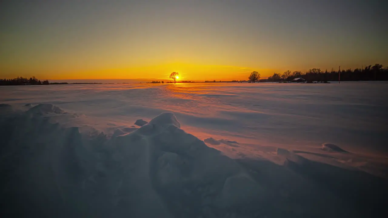 Cinematic sunset view through snow covered mountain landscape Time-lapse