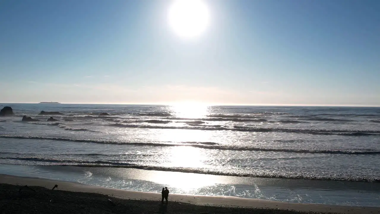 Scorching heat and silhouettes of a couple on Coastal Ruby Beach Washington