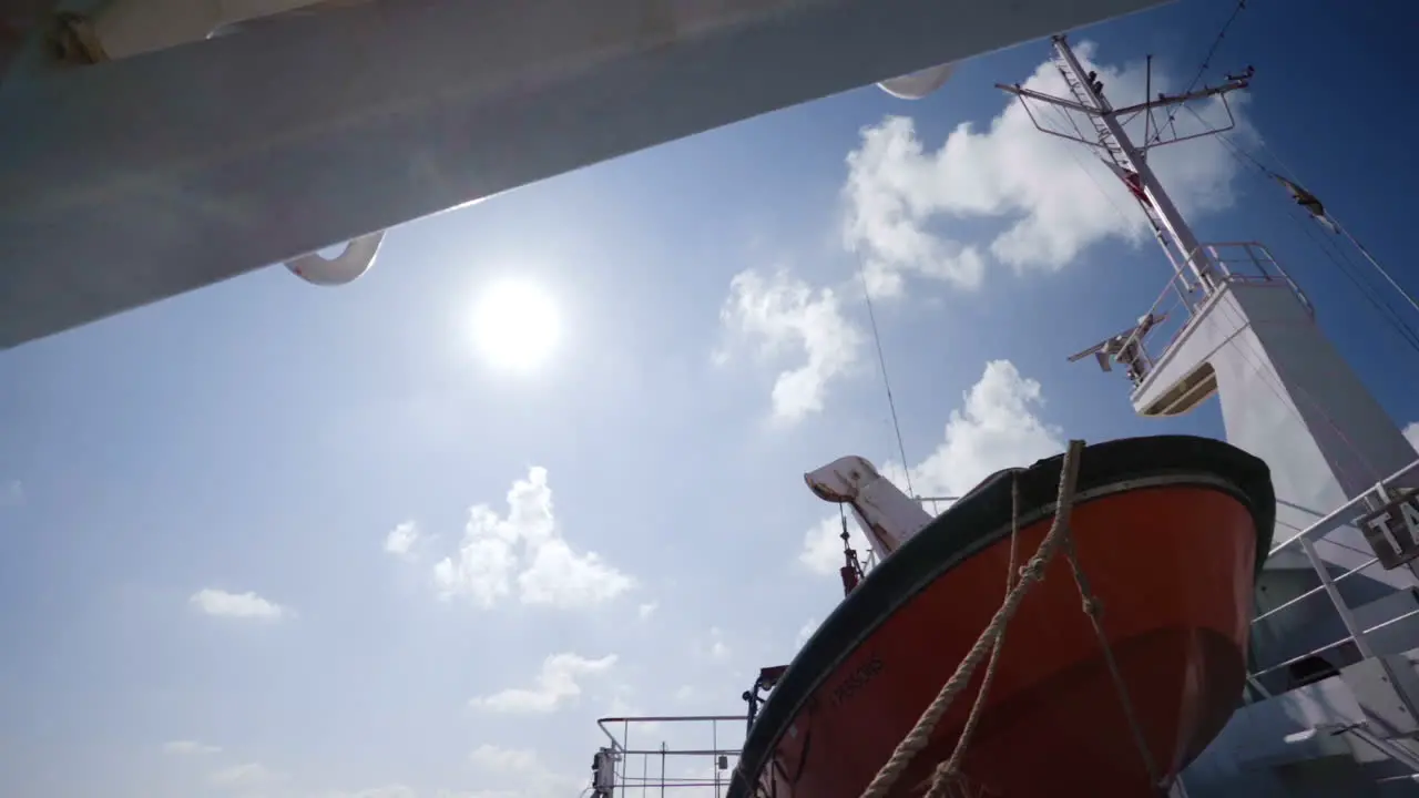 Gimbal shot of lifeboat on ferry that travels to Malta on sunny day