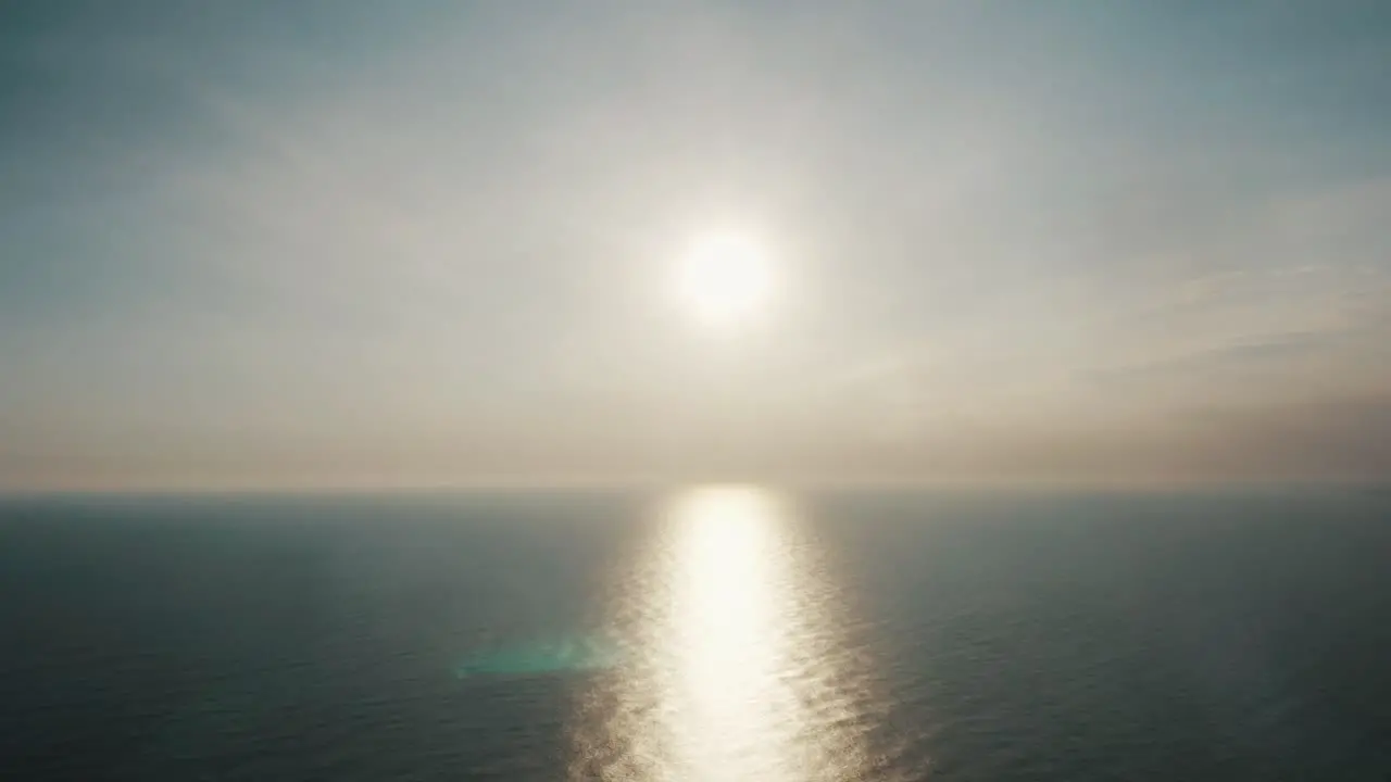 Bright Sunlight Reflection On Seascape Surface During Sunrise