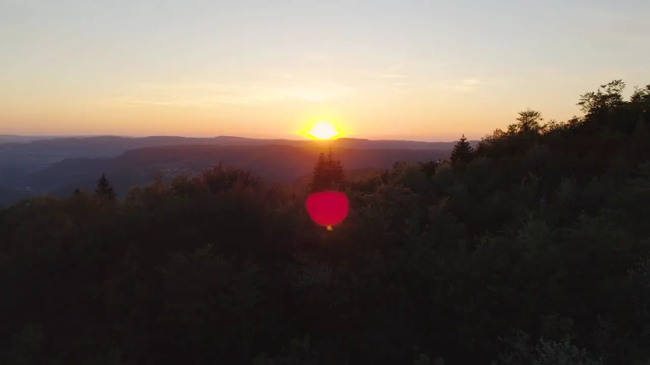 Gorgeous drone golden hour sunset in the mountain with flare