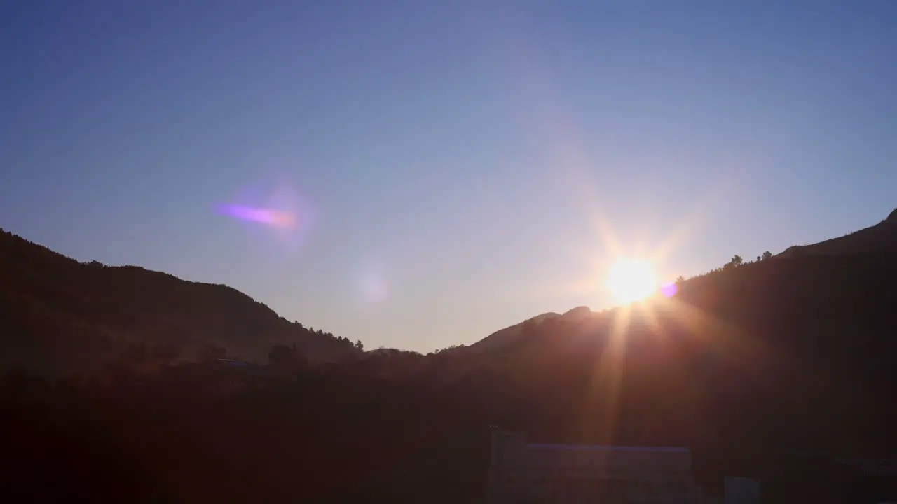 Time Lapse of a sunrise and fog over the mountains in the small village of Montan in the Community of Valencia Spain