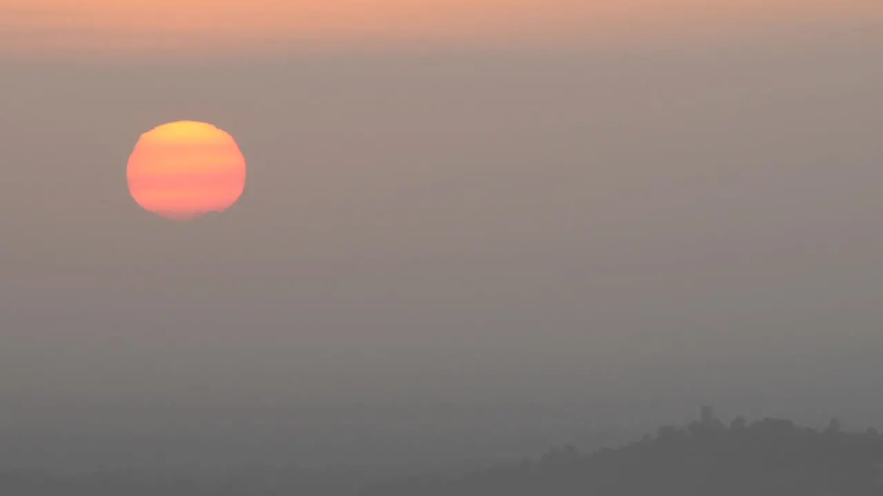 Time lapse of sun rising through the haze from Mount Hollywood in Griffith Park