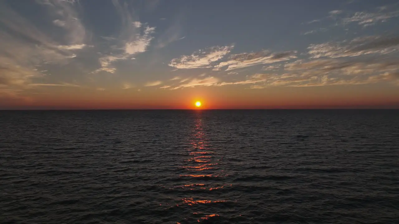 Aerial reverse view of Sunset over Mobile Bay near the Fairhope yacht Club