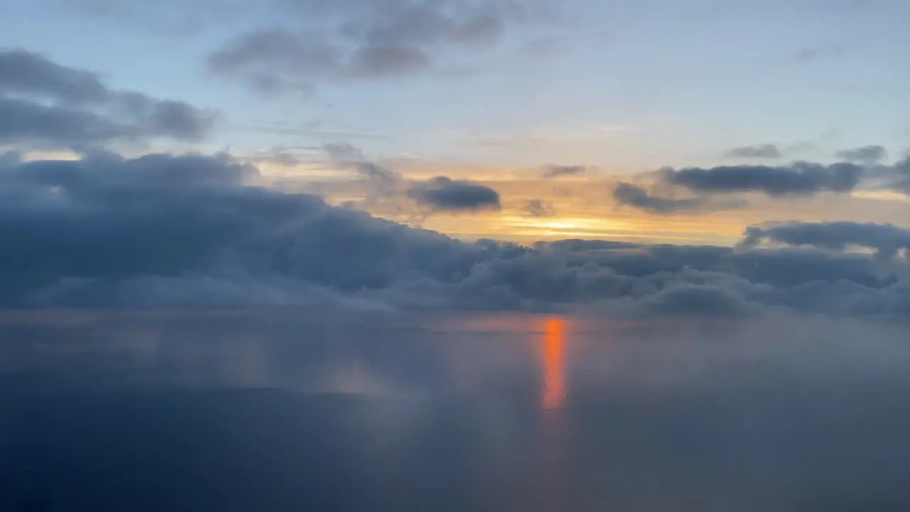 Aerrial view of a sunset over the mediterranean sea with a beautifull red sunbeam over the sea