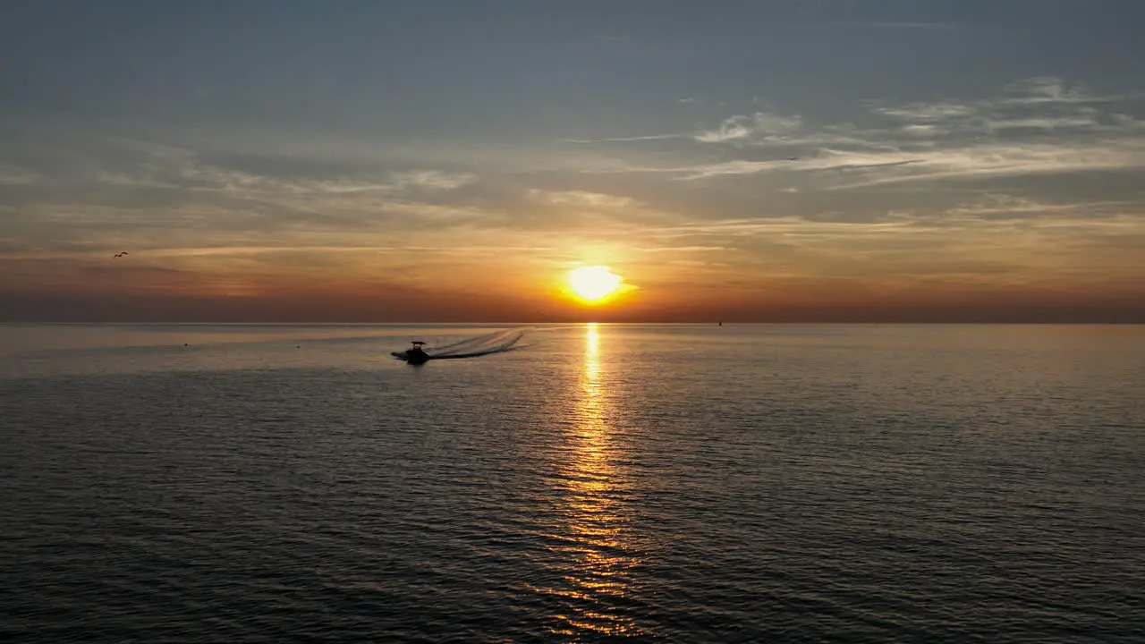 Boater heading in at sunset near Pelican point on Mobile Bay Alabama