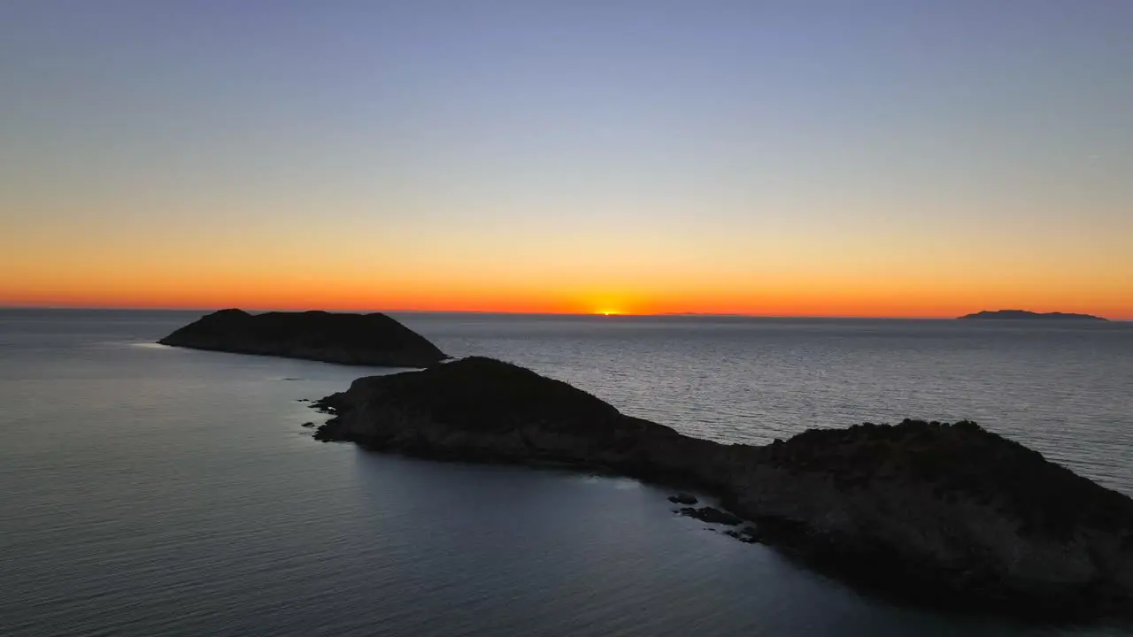 drone flight in small peninsula located in the sea of cortez of Mexico at sunset