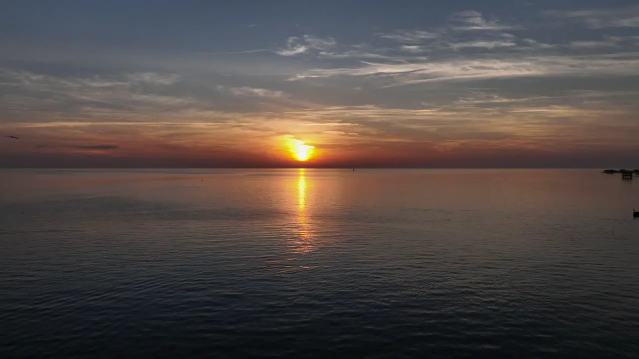 Sun over Mobile Bay at sunset near Pelican Point in Fairhope Alabama