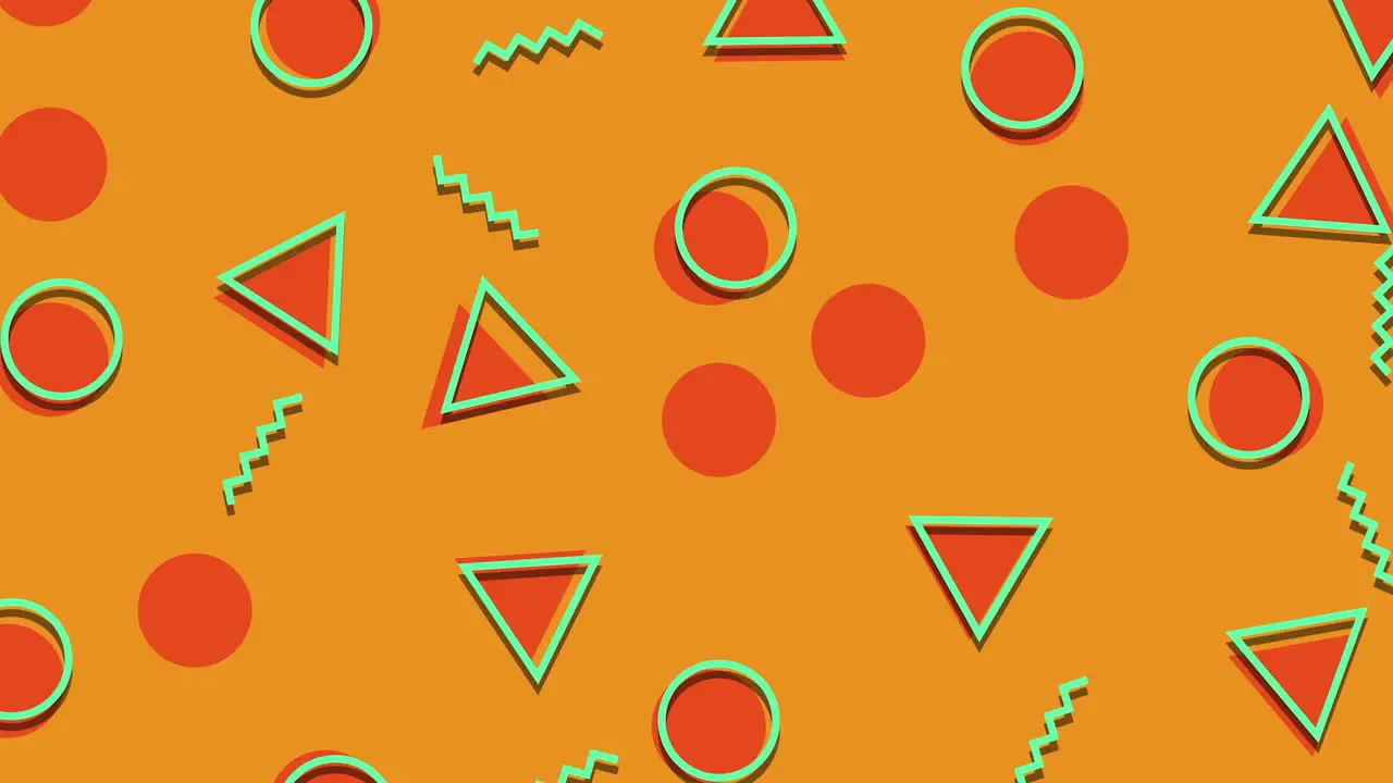 Animated graphic shape pattern loop colorful geometric shapes of circles triangles and lines on orange background moving