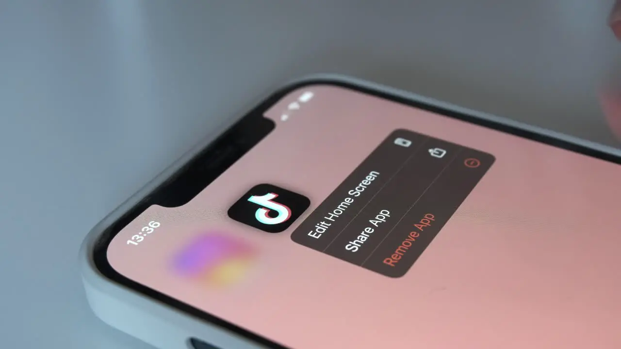 Taking Control Close-Up of Finger Removing Tik-Tok App Risk of Technology Addiction