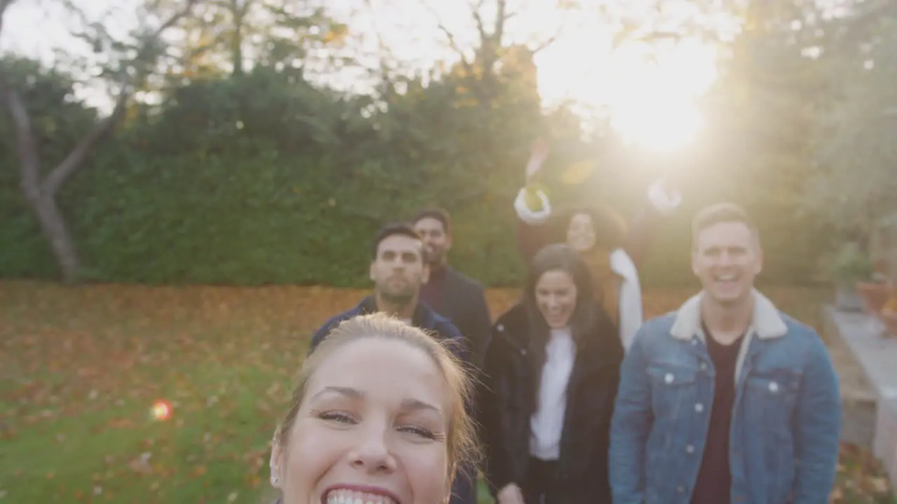 Portrait Of Multi Cultural Group Of Friends Posing For Selfie On Outdoor Walk In Countryside