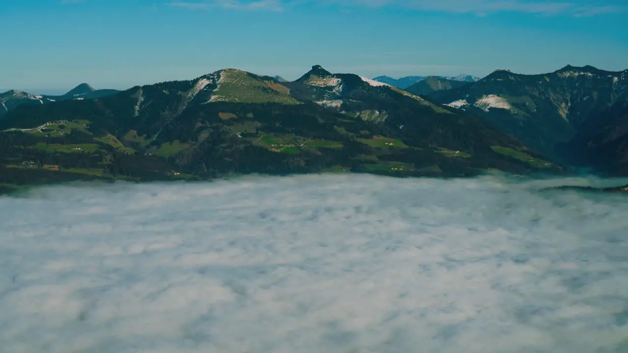 4K UHD time lapse cinemagraph of moving fog clouds bove Austria and Bavaria seen from Berchtesgaden 's famous Rossfeld Panorama Road in winter