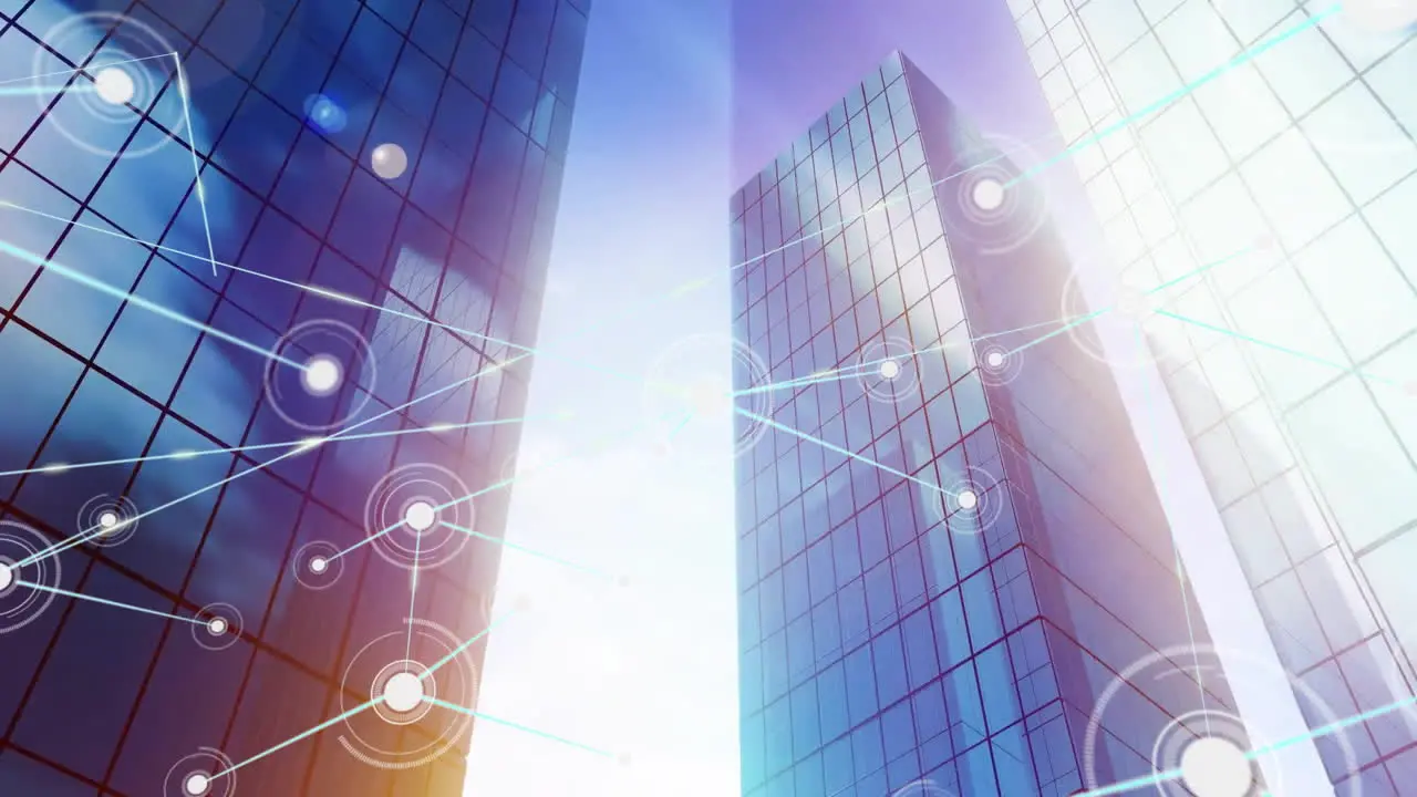 Animation of connected dots over lens flares and low angle view of buildings against cloudy sky