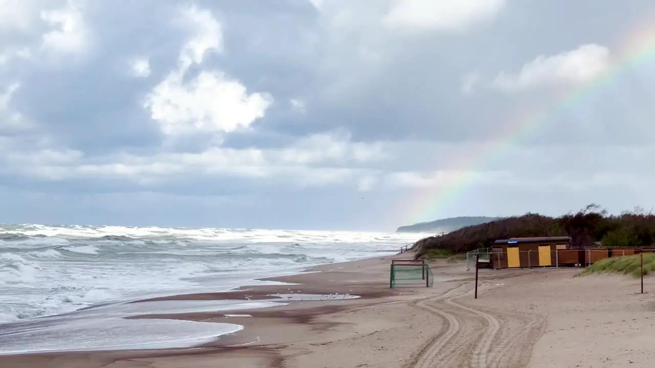 Dramatic Coastal Beauty Waves Rainbow and Ocean Majesty in Palanga Lithuania