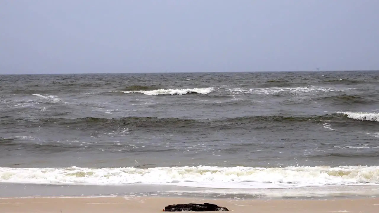 Distant white caps and small waves on a cloudy windy Gulf of Mexico Day