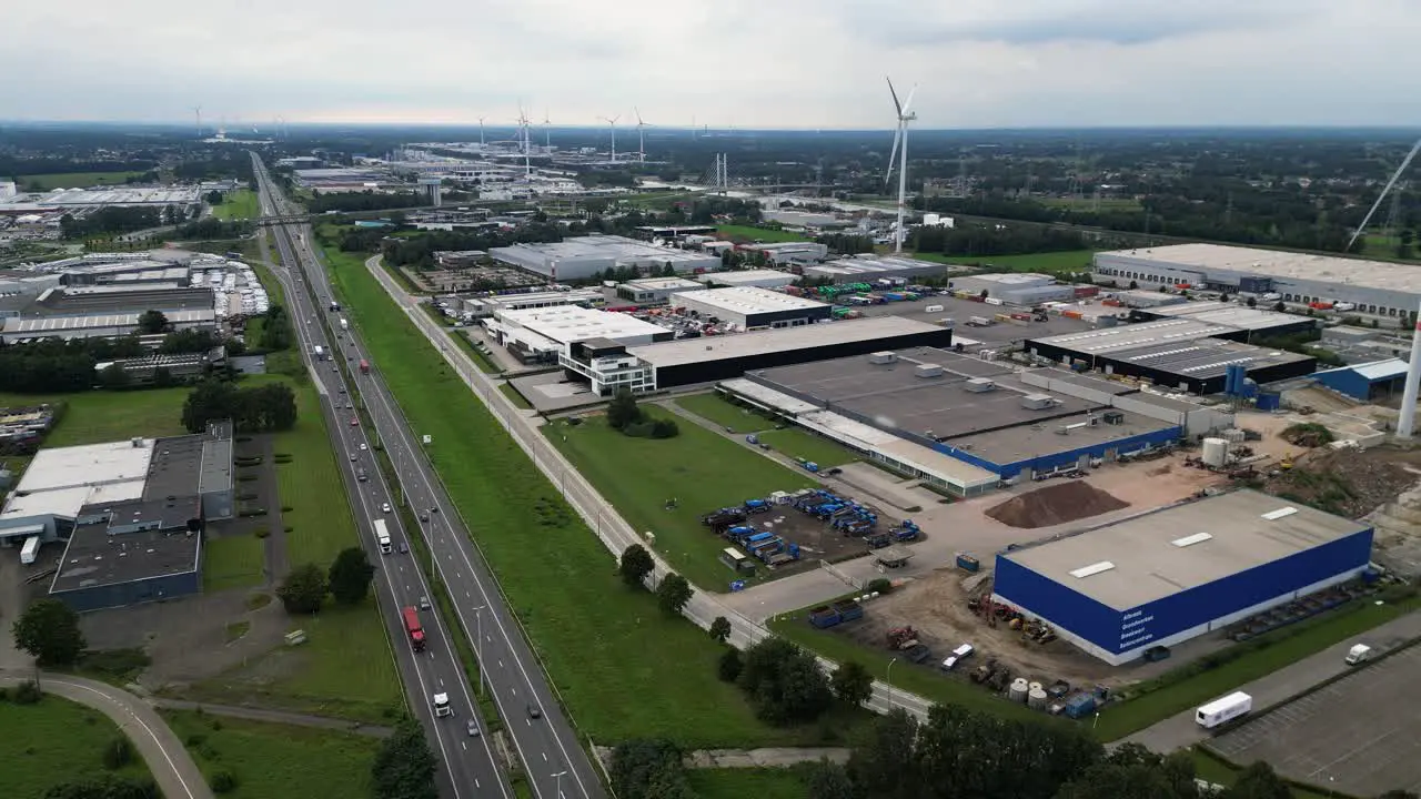 Busy highway leading through commercial area of city aerial view