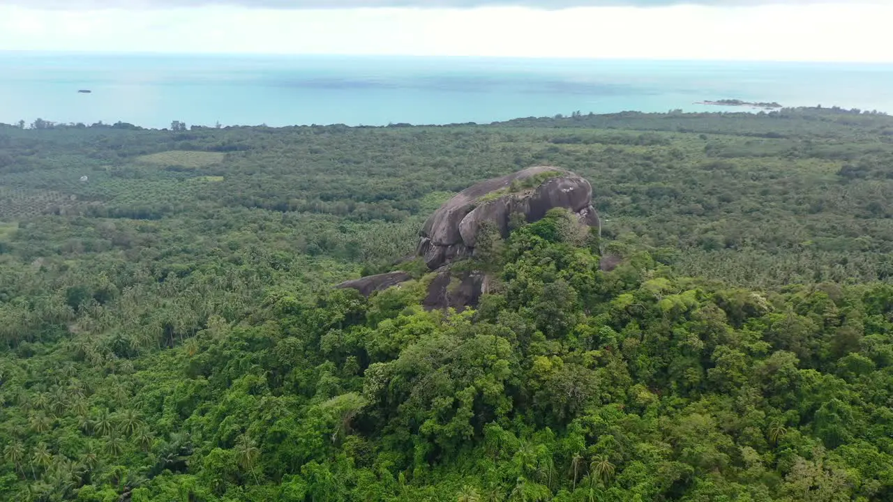 aerial of Batu Baginda boulder on a cloudy