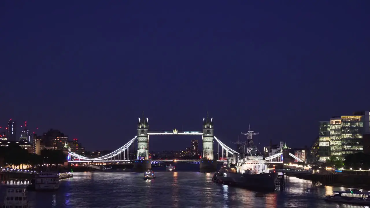 Night view of Tower Bridge in London with boat on Thames river beautiful background