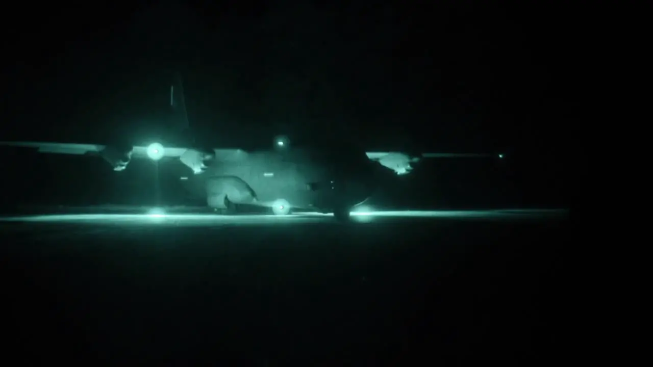 Night Vision Clip Of A Us Air Force Transport Plane Taxiing On A Run Way And Nighttime Loading Operation Angaur Palau