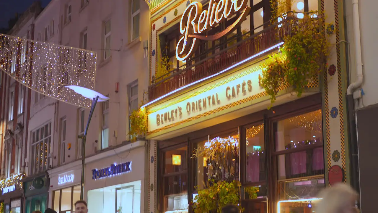 Establisher entrance of Bewleys Oriental Cafes in the evening with tourists