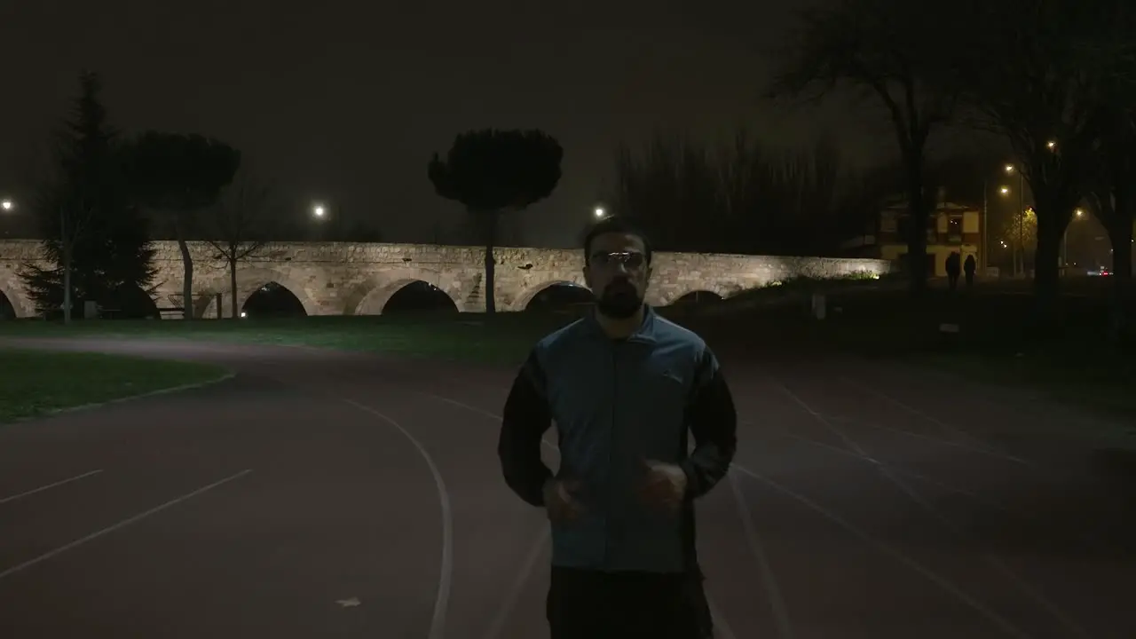 Athletic Person Warming Up On Terrain Before Start Jogging Aqueducts In Background