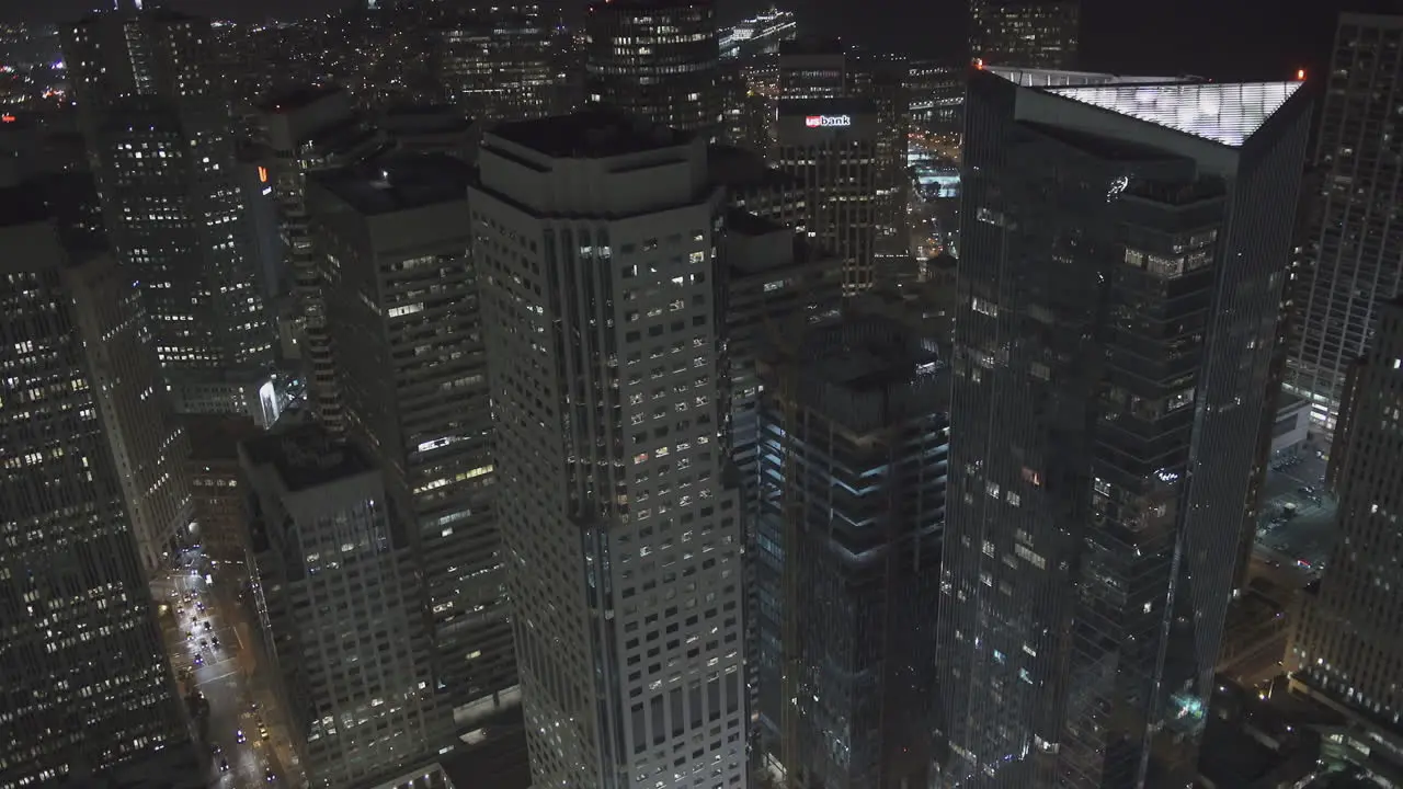 A city skyline full of towering skyscrapers and buildings at night