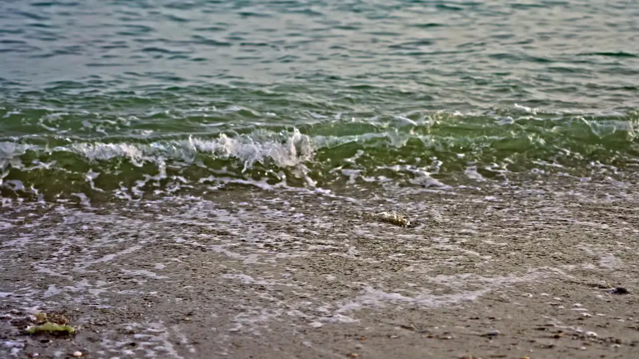 Ocean beach waves and foam in slow motion