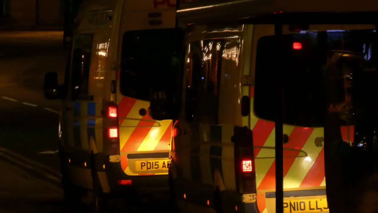 Liverpool Merseyside police van moving off from city road driving away after incident call