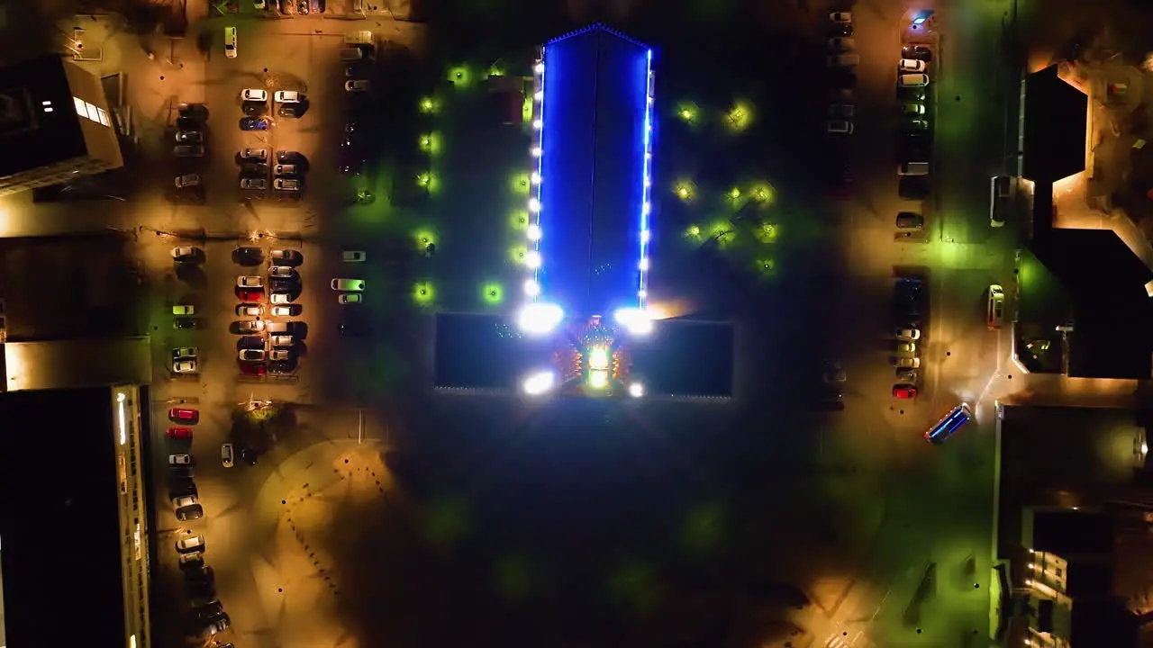 Aerial view tilting over the illuminated Hallgrímskirkja church night in Reykjavik Iceland