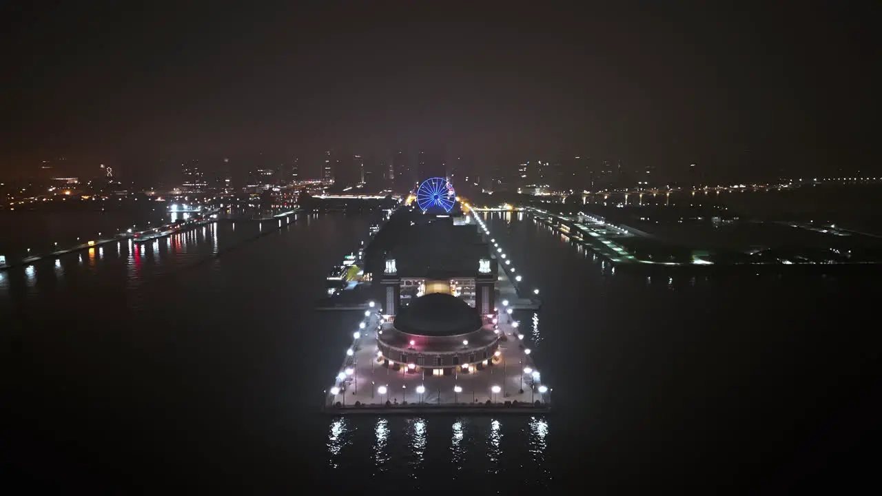 Aerial view over the illuminated Navy pier quiet misty night in Chicago USA