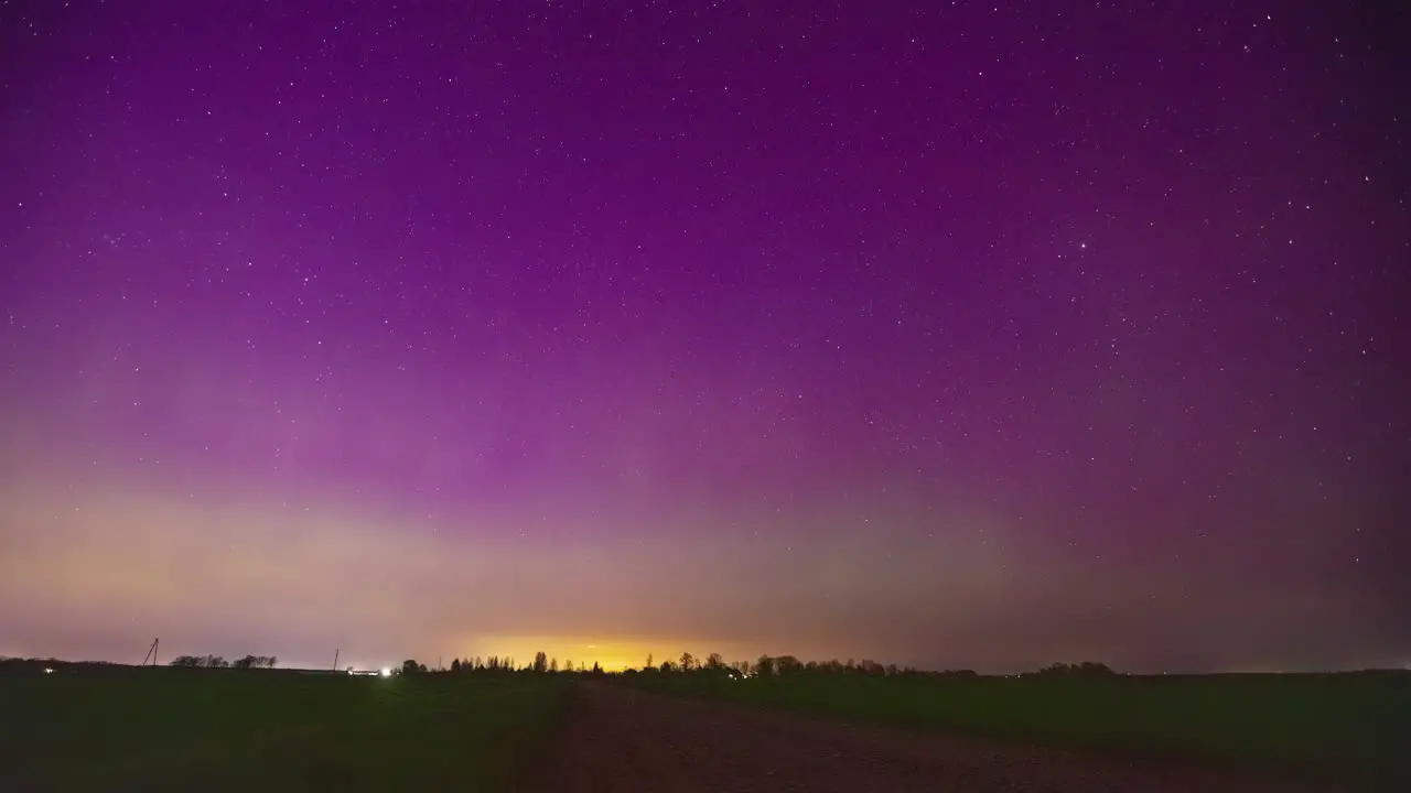 Northern lights or aurora borealis above the horizon time lapse