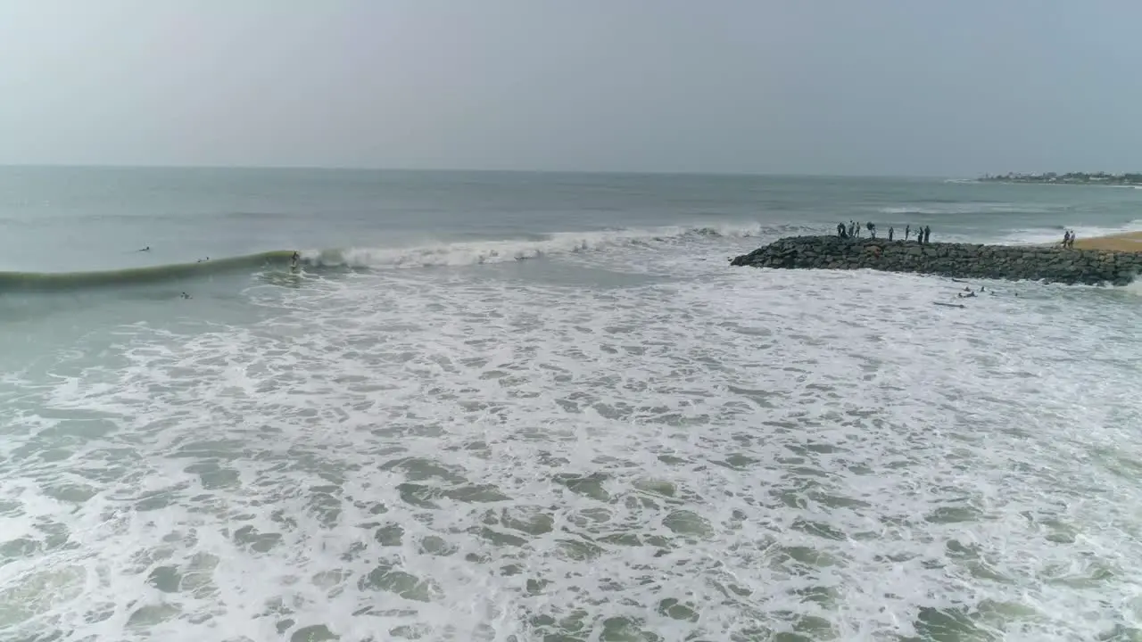 Drone videos of People surfing on a Beach in India 4K 60 fps down scaled t0 30 fps