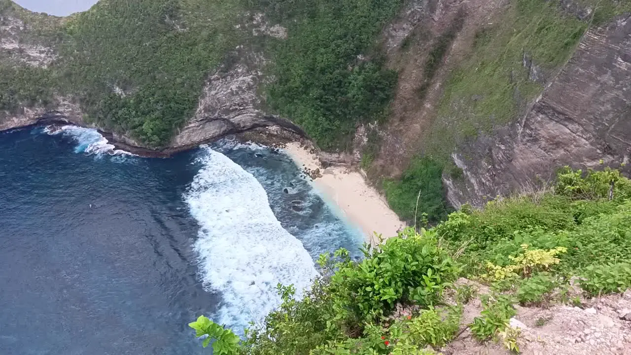 Waves and cliffs of Kelingking Beach Nusa Penida Bali Indonesia