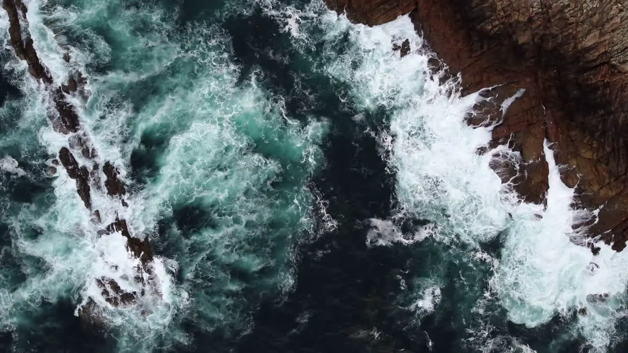 Coastal Waves Creating Mesmerizing Oceanic Textures Aerial spinning Top-Down View