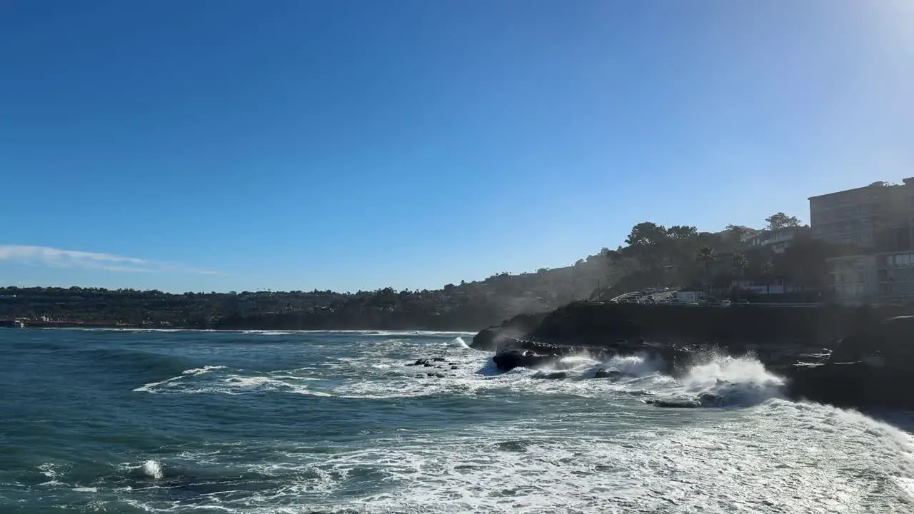 4K footage of large ocean waves crashing on cliffs during high tide in La Jolla Cove San Diego California