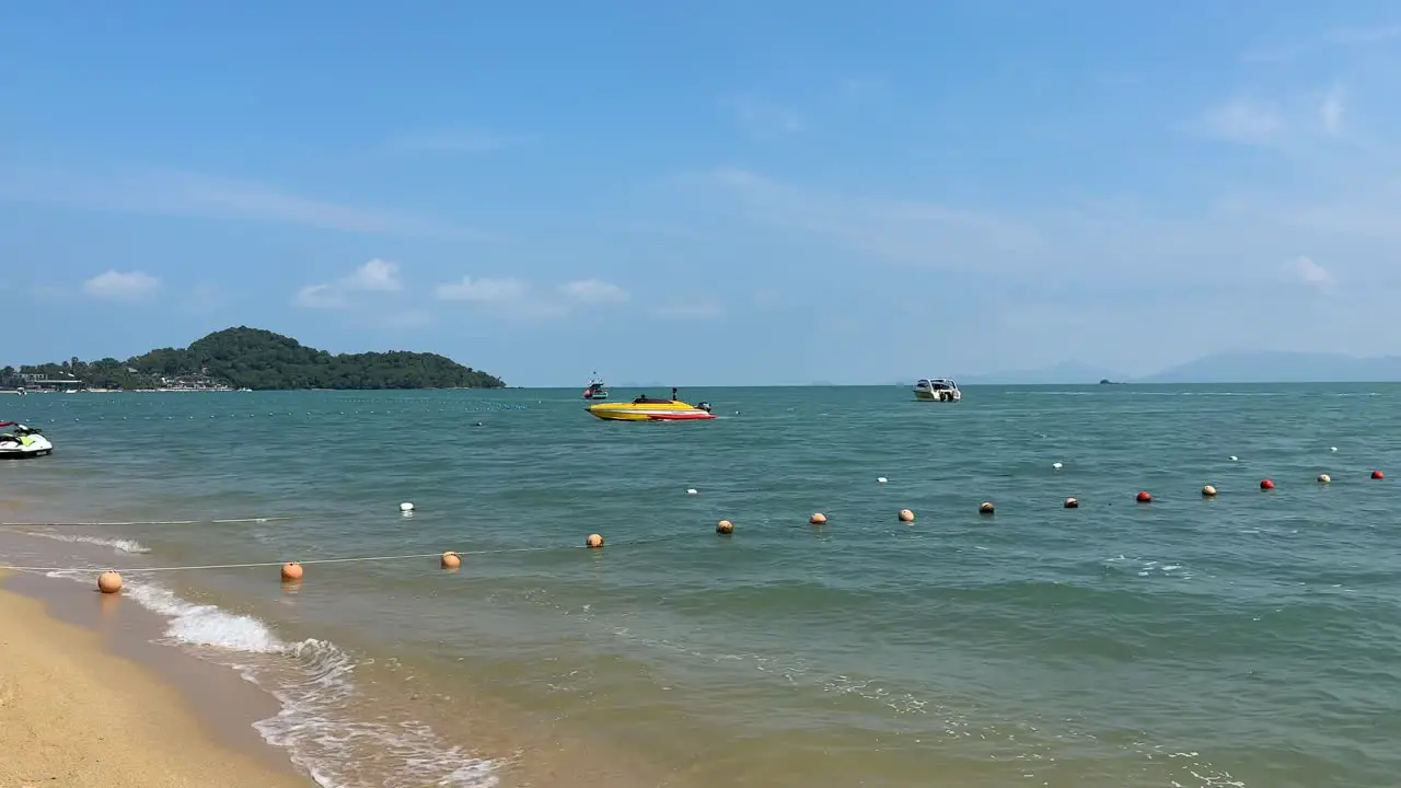 Boats and Jet Ski on Water on Bophut Beach in Koh Samui Thailand