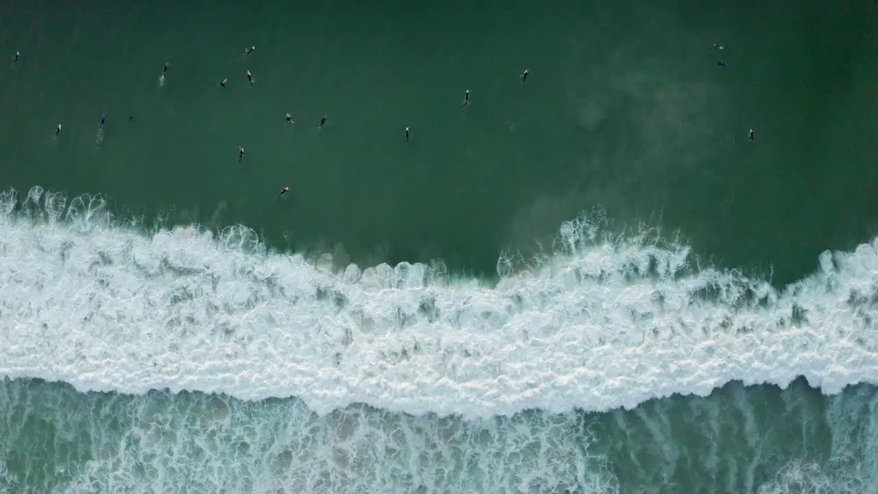 Aerial Llandudno big wave surfers sunset