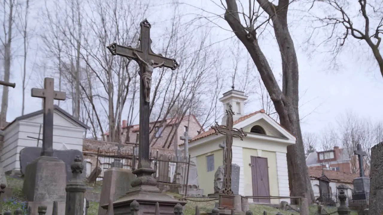 Metal Crosses with Jesus Christ in Bernardinai Graveyard on a Gloomy Day