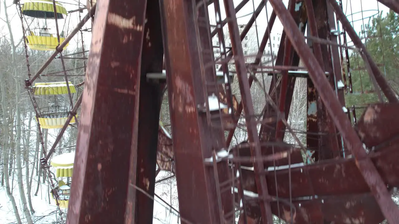 Rusty Ferris wheel in Pripyat Chernobyl exclusion zone in winter snow