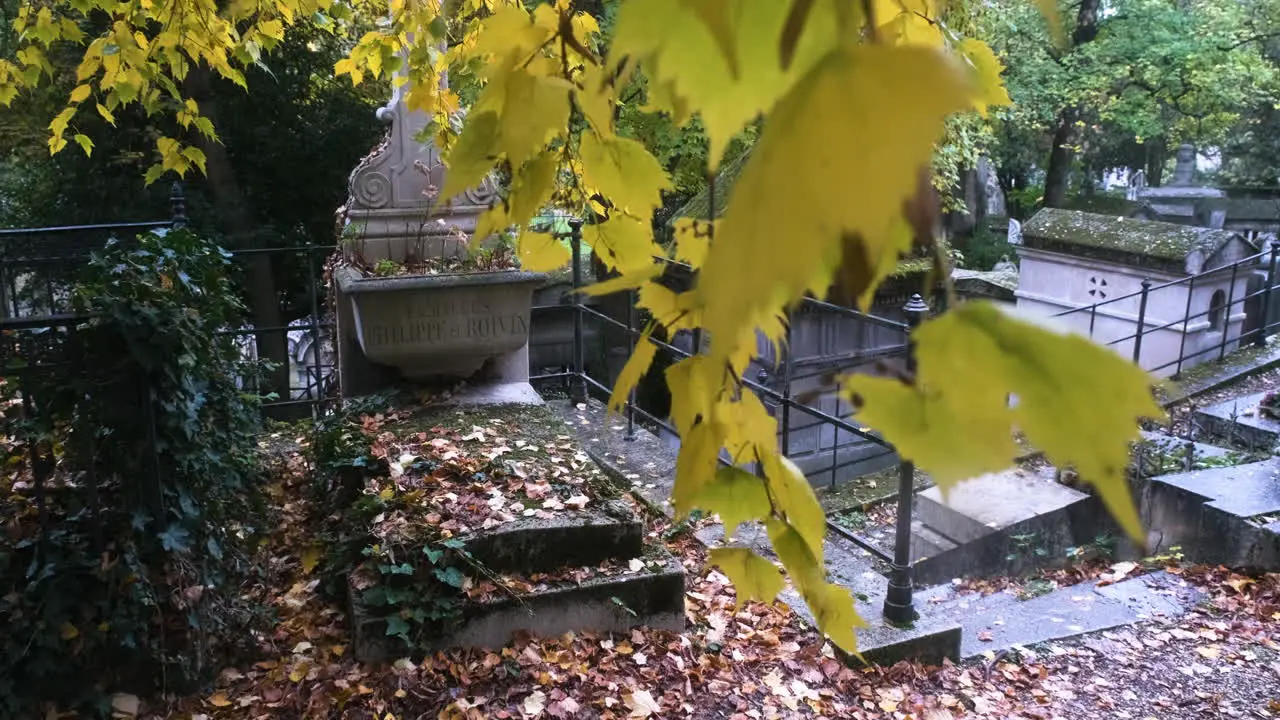 lateral tracking of a stone tomb in the pere lachaise cemetary