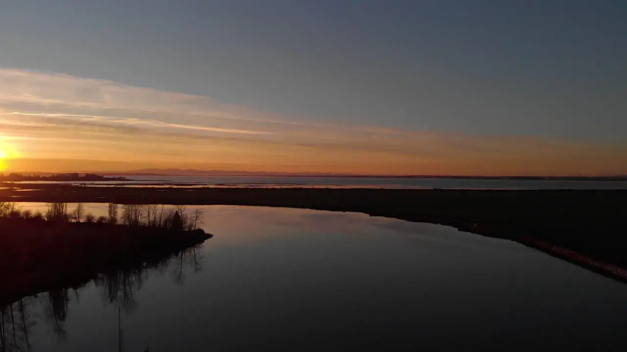 Drone 4K Footage Historic Stewart Farm Beautiful Dark Eerie Strange and Mysterious Dusk Sunset over Deep and Calm Water