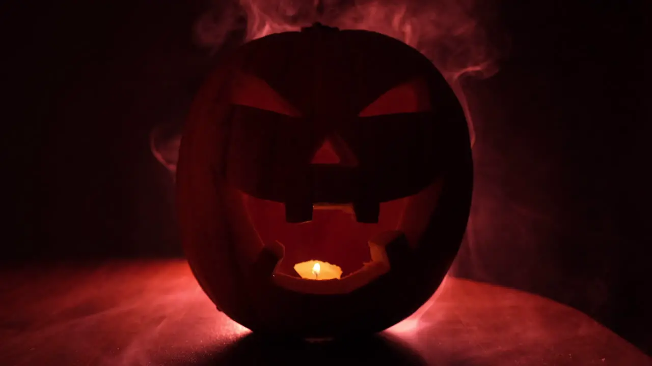 Halloween pumpkin in creepy red smoke mist