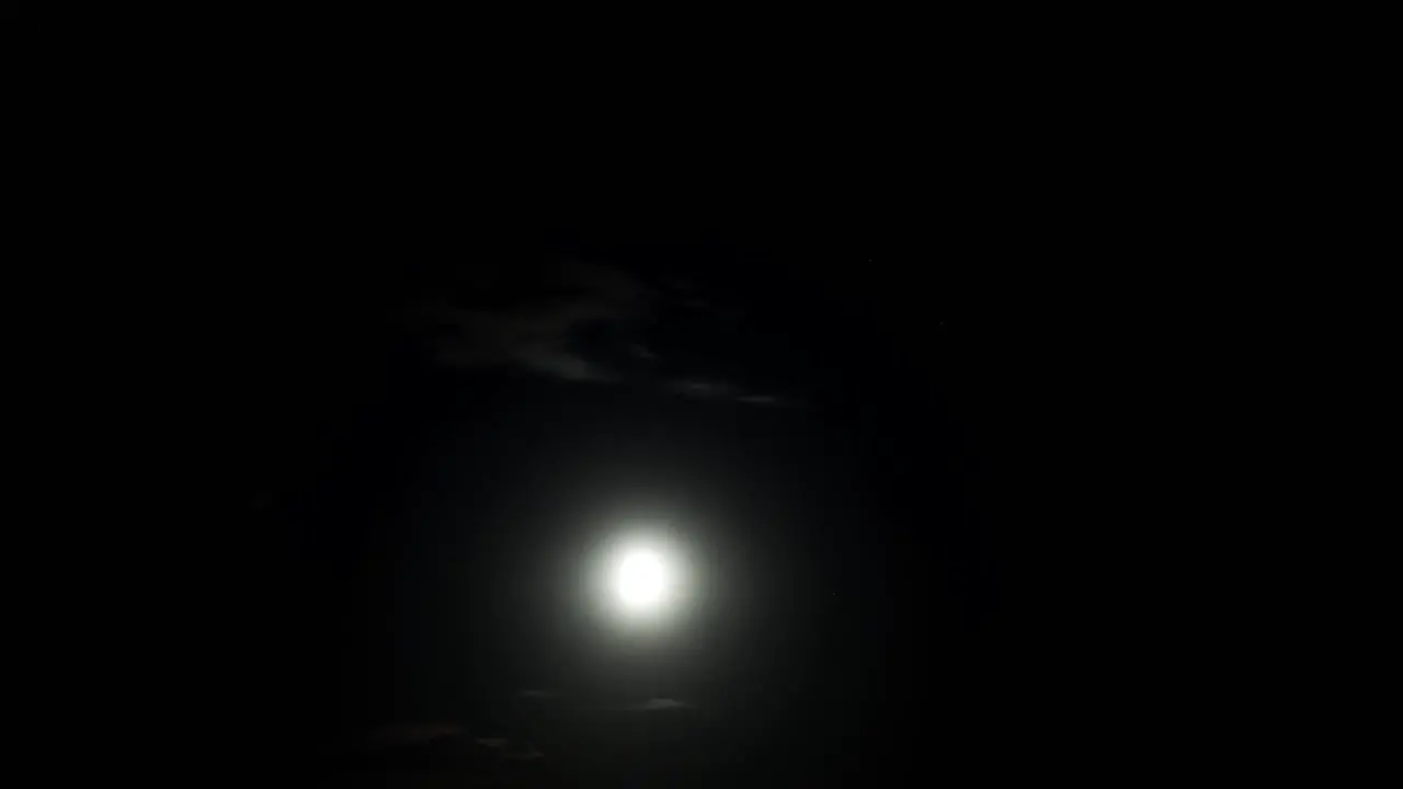 Time lapse of the moon passing by at night