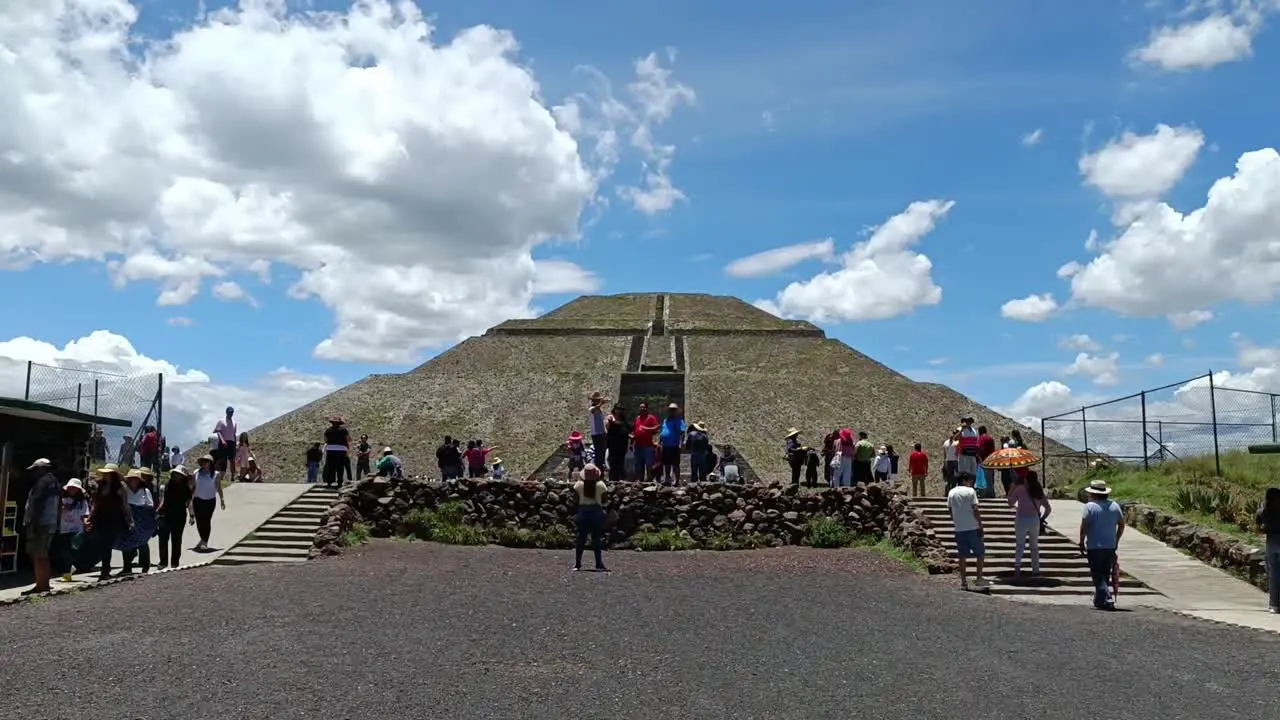 Slow motion shot of tourists admiring the architecture at the Teotihuacan Pyramids in Mexico