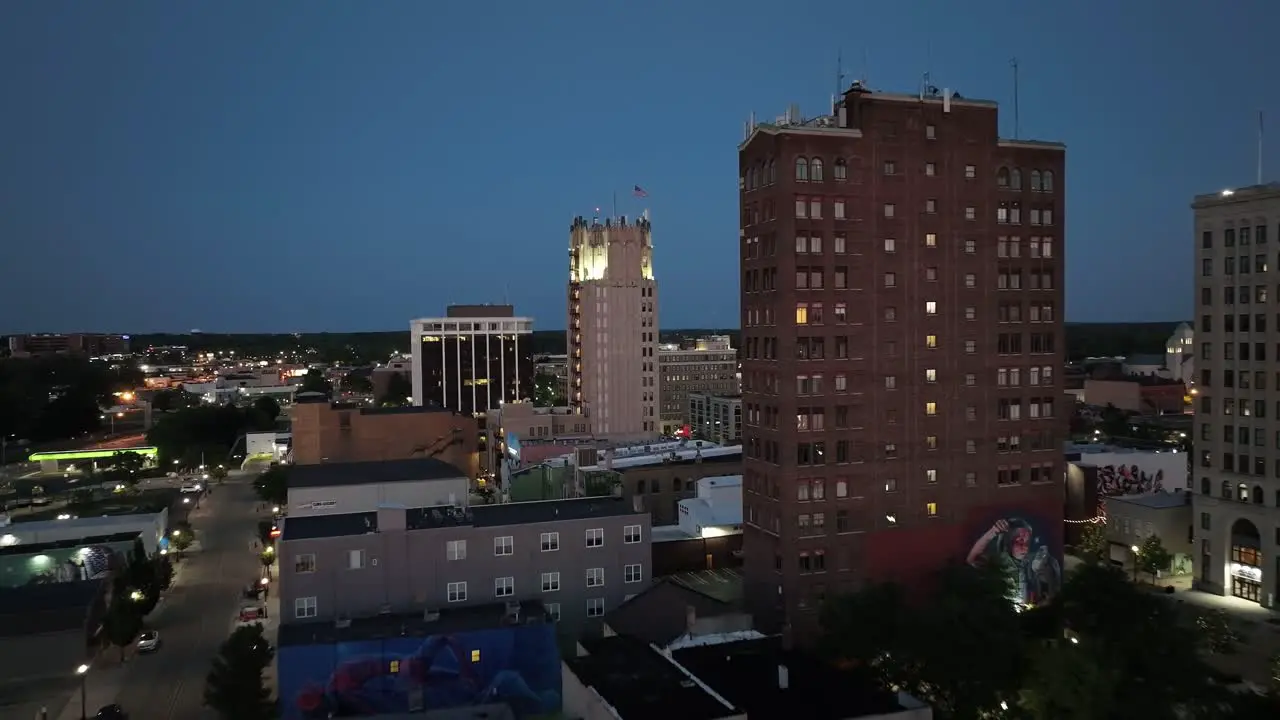 Jackson Michigan downtown at night with drone video moving in