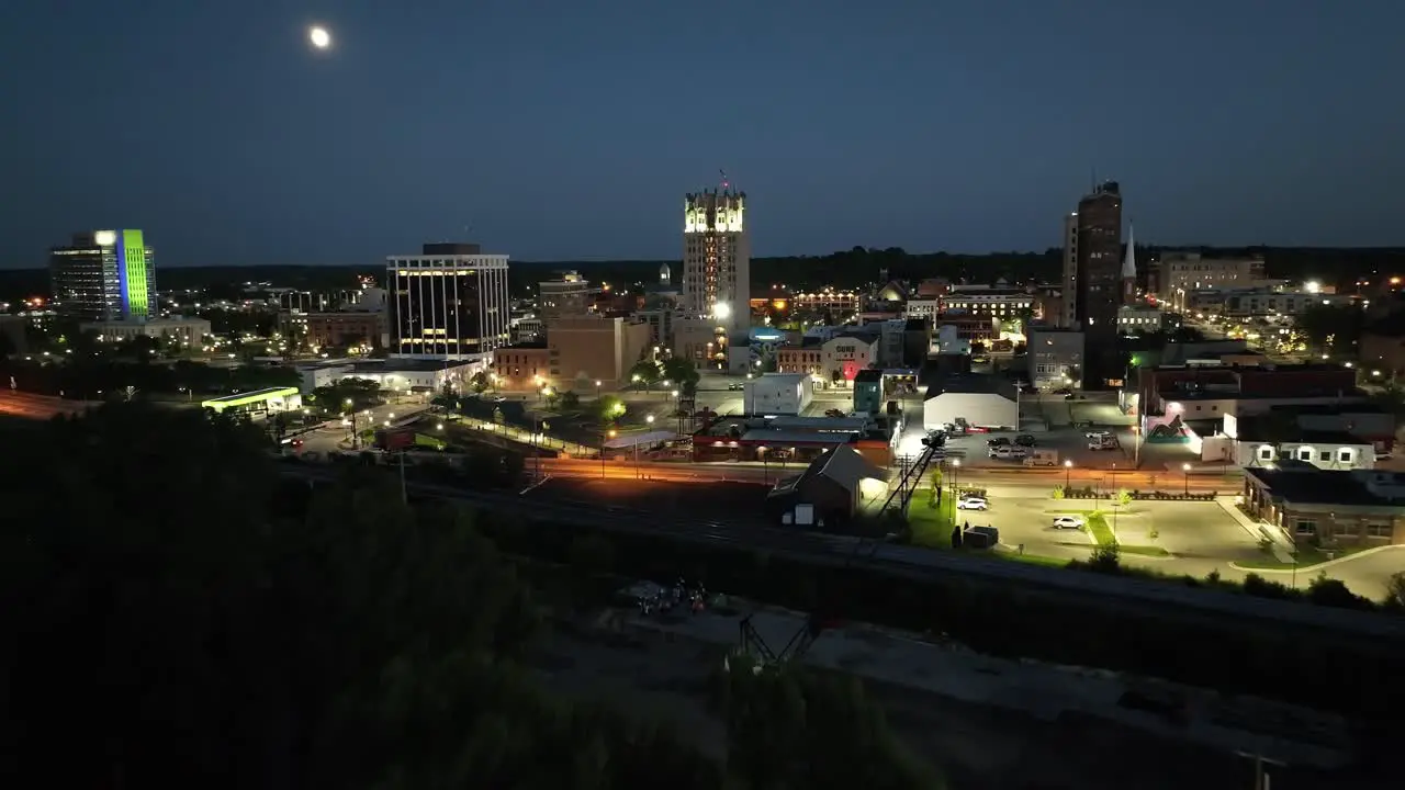 Jackson Michigan downtown at night with drone video wide shot moving in