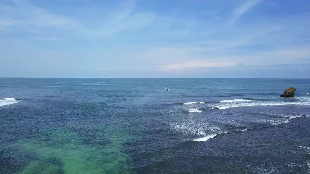 Aerial view of fisherman boat on clear ocean water of Indonesia during summer